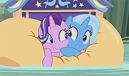 Size: 255x151 | Tagged: safe, screencap, character:starlight glimmer, character:trixie, species:pony, species:unicorn, episode:on the road to friendship, animated, cheek squish, cute, diatrixes, duo, female, floating, gif, glimmerbetes, inflatable, inflatable raft, looking at each other, mare, raft, squishy cheeks, trixie's wagon, we're friendship bound