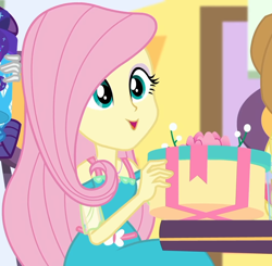 Size: 1000x980 | Tagged: safe, screencap, character:fluttershy, equestria girls:holidays unwrapped, g4, my little pony:equestria girls, canterlot mall, chair, clothing, cropped, cute, dashing through the mall, dress, female, flower, geode of fauna, gift box, gift giving, jewelry, magical geodes, mall, necklace, present, shyabetes, sitting, smiling, table, waistband