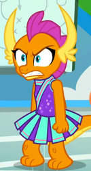 Size: 464x864 | Tagged: safe, screencap, character:smolder, species:dragon, episode:2-4-6 greaaat, angry, cheerleader, cheerleader outfit, cheerleader smolder, clenched fist, clothing, cropped, cute, cute when angry, dragoness, fangs, female, gym, horns, shrunken pupils, skirt, slit eyes, smolder is not amused, smolderbetes, solo, teenaged dragon, teenager, toes, unamused