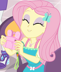 Size: 855x1000 | Tagged: safe, screencap, character:fluttershy, character:rarity, equestria girls:holidays unwrapped, g4, my little pony:equestria girls, bunny ears, camera, canterlot mall, chair, clothing, cropped, cute, dashing through the mall, dress, eyes closed, female, flower, geode of fauna, gift giving, hairclip, happy, jewelry, magical geodes, mall, necklace, present, shyabetes, sitting, smiling, table, waistband