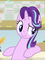 Size: 701x938 | Tagged: safe, screencap, character:starlight glimmer, species:pony, species:unicorn, episode:a horse shoe-in, g4, my little pony: friendship is magic, bipedal, bipedal leaning, cropped, desk, female, leaning, leaning back, mare, smiling, smirk, solo