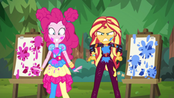 Size: 1920x1080 | Tagged: safe, screencap, character:pinkie pie, character:sunset shimmer, equestria girls:sunset's backstage pass, g4, my little pony:equestria girls, angry, clothing, cute, diapinkes, duo, duo female, easel, female, geode of empathy, geode of sugar bombs, happy, magical geodes, messy, music festival outfit, outdoors, paint, pantyhose, smiling, sunset shimmer is not amused, unamused, varying degrees of amusement