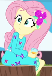 Size: 340x491 | Tagged: safe, screencap, character:fluttershy, equestria girls:sunset's backstage pass, g4, my little pony:equestria girls, beverage, clothing, cropped, cup, dress, eyes widened, female, hairclip, long sleeves, looking back, looking up, rv, sitting, tree stump, waistband