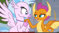 Size: 496x278 | Tagged: safe, screencap, character:silverstream, character:smolder, species:classical hippogriff, species:dragon, species:hippogriff, episode:school daze, g4, my little pony: friendship is magic, dragoness, duo, female, holding hands, horns, looking at each other, narrowed eyes, open mouth, raised arm, raised eyebrow, spread wings, teenaged dragon, teenager, wings, youtube, youtube link