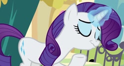 Size: 1432x768 | Tagged: safe, screencap, character:rarity, species:pony, species:unicorn, episode:dragon dropped, g4, my little pony: friendship is magic, cropped, faec, female, magic, mare, scrunchy face, smiling, solo