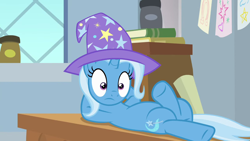 Size: 1280x720 | Tagged: safe, screencap, character:trixie, species:pony, species:unicorn, episode:a horse shoe-in, g4, my little pony: friendship is magic, awkward moment, book, classroom, clothing, desk, hat, solo, trixie's hat