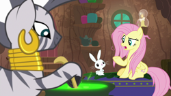 Size: 1920x1080 | Tagged: safe, screencap, character:angel bunny, character:fluttershy, character:zecora, species:pegasus, species:pony, species:rabbit, species:zebra, episode:she talks to angel, g4, my little pony: friendship is magic, animal, cauldron, ear piercing, earring, female, jewelry, male, mare, messy mane, neck rings, piercing, sitting, zecora's hut