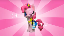 Size: 2048x1143 | Tagged: safe, screencap, character:pinkie pie, species:earth pony, species:pony, g4.5, my little pony: stop motion short, my little pony:pony life, clothing, dress, fashion failure, female, mare, one eye closed, open mouth, smiling, solo, sparkles, stop motion, winking at you