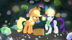 Size: 1920x1080 | Tagged: safe, screencap, character:applejack, character:rarity, species:earth pony, species:pony, species:unicorn, episode:dragon dropped, g4, my little pony: friendship is magic, annoyed, basket, cave, clothing, duo, female, gem, gem cave, hard hat, hat, headlamp, helmet, lantern, mare, mining helmet