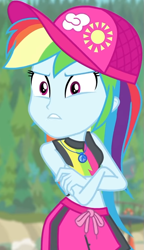 Size: 491x850 | Tagged: safe, screencap, character:rainbow dash, equestria girls:forgotten friendship, g4, my little pony:equestria girls, angry, bikini, bikini top, blurred background, board shorts, cap, clothing, cloud, cropped, crossed arms, female, forest background, geode of super speed, hat, jewelry, magical geodes, midriff, necklace, outdoors, rainbow, shorts, sleeveless, sun, swimsuit, talking, thunderbolt