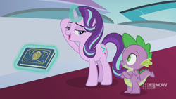 Size: 1280x720 | Tagged: safe, screencap, character:spike, character:starlight glimmer, species:dragon, species:pony, species:unicorn, episode:memories and more, 9now, bedroom eyes, book, crossed arms, duo, levitation, looking at each other, magic, magic aura, scrapbook, telekinesis, winged spike