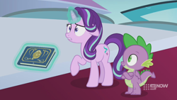 Size: 1280x720 | Tagged: safe, screencap, character:spike, character:starlight glimmer, species:dragon, species:pony, species:unicorn, episode:memories and more, 9now, book, crossed arms, duo, levitation, magic, magic aura, scrapbook, shrunken pupils, telekinesis, winged spike, worried