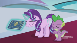Size: 1280x720 | Tagged: safe, screencap, character:spike, character:starlight glimmer, species:dragon, species:pony, species:unicorn, episode:memories and more, 9now, book, crossed arms, duo, eyes closed, levitation, magic, magic aura, scrapbook, telekinesis, winged spike