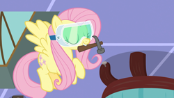 Size: 1920x1080 | Tagged: safe, screencap, character:fluttershy, species:pegasus, species:pony, episode:discordant harmony, g4, my little pony: friendship is magic, hammer, mouth hold, safety goggles, solo