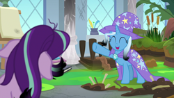 Size: 1920x1080 | Tagged: safe, screencap, character:starlight glimmer, character:trixie, species:pony, species:unicorn, episode:a horse shoe-in, g4, my little pony: friendship is magic, burnt mane, cape, cattails, clothing, eyes closed, female, hat, mare, mess, raised hoof, scorched, smiling, trixie's cape, trixie's hat