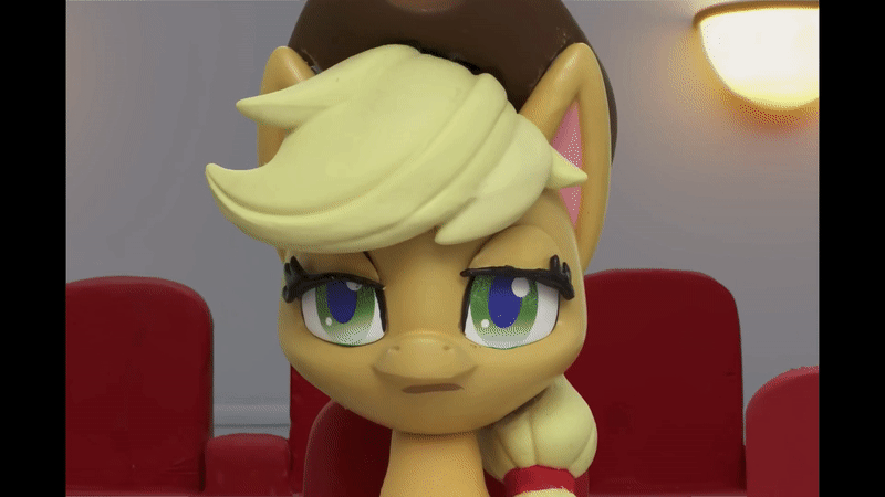 Size: 800x450 | Tagged: safe, screencap, character:applejack, species:earth pony, species:pony, g4.5, my little pony: stop motion short, my little pony:pony life, animated, applejack's hat, clothing, cowboy hat, cropped, eyeroll, female, gif, hat, hat in the way, light, sigh, solo, stop motion, theater, theater seat