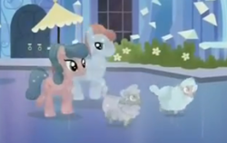 Size: 357x225 | Tagged: safe, screencap, species:crystal pony, species:pony, species:sheep, episode:games ponies play, g4, my little pony: friendship is magic, background pony, duo, ewe, female, looking up, male, mare, sapphire rose, smiling, stallion, tiny ewes, walking, zirconic