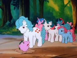 Size: 1000x755 | Tagged: safe, screencap, character:baby cuddles, character:buttons (g1), character:cupcake (g1), character:fizzy, character:gusty, character:spike (g1), species:dragon, species:earth pony, species:pegasus, species:pony, species:unicorn, episode:the end of flutter valley, g1, my little pony 'n friends, baby, baby dragon, bow, cutie mark, dirt, female, filly, foal, forest, help me, looking down, mare, tail bow, tree