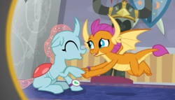 Size: 718x411 | Tagged: safe, screencap, character:ocellus, character:smolder, species:changedling, species:changeling, species:dragon, species:reformed changeling, episode:a matter of principals, g4, my little pony: friendship is magic, cropped, cute, diaocelles, dragoness, duo, eyes closed, female, flying, holding hands, shipping, smiling, smolderbetes, watch