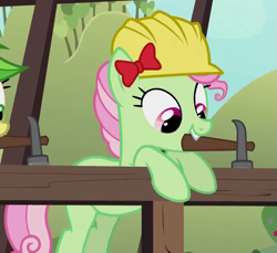 Size: 809x741 | Tagged: safe, screencap, character:florina tart, species:earth pony, species:pony, episode:apple family reunion, g4, my little pony: friendship is magic, apple family member, background pony, bow, cropped, female, hair bow, hammer, hard hat, hat, mare, mouth hold, solo focus