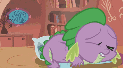 Size: 500x277 | Tagged: safe, screencap, character:spike, species:dragon, episode:the return of harmony, g4, my little pony: friendship is magic, animated, bed, burp, dragon mail, dragonfire, fire, green fire, male, puffy cheeks, solo, tongue out