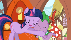 Size: 1054x592 | Tagged: safe, screencap, character:spike, character:twilight sparkle, character:twilight sparkle (unicorn), species:dragon, species:pony, species:unicorn, episode:dragon quest, g4, my little pony: friendship is magic, bindle, duo, eyes closed, female, hug, male, mare