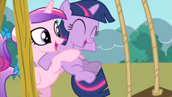 Size: 853x480 | Tagged: safe, screencap, character:princess cadance, character:twilight sparkle, species:pony, episode:a canterlot wedding, g4, my little pony: friendship is magic, duo, eyes closed, female, filly, filly twilight sparkle, foalsitter, holding a pony, swing, swing set, teen princess cadance, younger