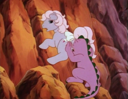 Size: 738x574 | Tagged: safe, screencap, character:baby lickety split, character:spike (g1), g1, my little pony: the movie (1986), butt touch, cliff, hand on butt, not what it looks like, out of context, pushing, rump push, wat