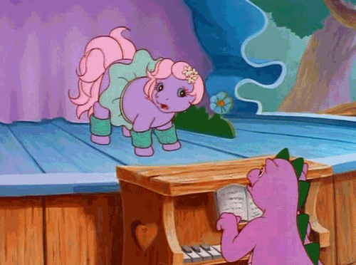 Size: 500x372 | Tagged: safe, screencap, character:baby lickety split, character:spike (g1), species:dragon, species:earth pony, species:pony, g1, my little pony: the movie (1986), animated, clothing, duo, female, filly, foal, leg warmers, male, musical instrument, piano, stage, tutu