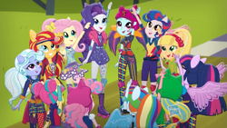 Size: 1079x607 | Tagged: safe, screencap, character:applejack, character:fluttershy, character:indigo zap, character:lemon zest, character:pinkie pie, character:rainbow dash, character:rarity, character:sour sweet, character:sugarcoat, character:sunny flare, character:sunset shimmer, character:twilight sparkle, character:twilight sparkle (scitwi), species:eqg human, equestria girls:friendship games, g4, my little pony:equestria girls, commercial, crystal prep academy, crystal prep shadowbolts, group, mane six, ponied up, scitwilicorn, unleash the magic (commercial), wondercolts