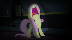 Size: 1920x1080 | Tagged: safe, screencap, character:fluttershy, species:pegasus, species:pony, episode:scare master, g4, my little pony: friendship is magic, d:, dark, faec, female, floppy ears, flutterscream, folded wings, frown, indoors, majestic as fuck, mare, nose in the air, open mouth, scared, screaming, solo, standing, tongue out, volumetric mouth, wide eyes, yelling