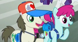 Size: 675x365 | Tagged: safe, screencap, character:rarity, character:ruby splash, species:earth pony, species:pony, episode:made in manehattan, g4, my little pony: friendship is magic, background pony, backpack, clothing, female, fortune favors, hat, male, mare, stallion
