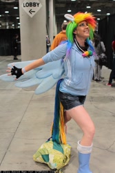 Size: 683x1024 | Tagged: artist needed, safe, character:rainbow dash, species:human, clothing, comikaze expo, comikaze expo 2011, cosplay, fingerless gloves, gloves, irl, irl human, photo, solo, wings