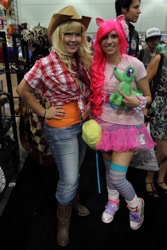 Size: 768x1152 | Tagged: artist needed, safe, character:applejack, character:gummy, character:pinkie pie, species:human, anime expo, anime expo 2012, bandana, clothing, convention, cosplay, irl, irl human, jeans, photo, plushie, skirt, tutu