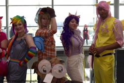 Size: 2048x1366 | Tagged: artist needed, safe, artist:destructivedoll, artist:drowninginrice, character:applejack, character:fluttershy, character:rainbow dash, character:rarity, species:human, applejack (male), clothing, convention, cosplay, gloves, irl, irl human, measuring tape, nekocon, nekocon 2012, photo, rule 63, tube skirt, vest