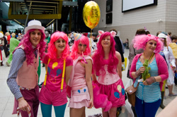 Size: 2688x1787 | Tagged: artist needed, safe, character:pinkie pie, species:human, 2013, balloon, bubble berry, clothing, convention, corset, cosplay, hat, irl, irl human, london mcm expo, multeity, party hat, photo, rule 63, suspenders, too much pink energy is dangerous, vest