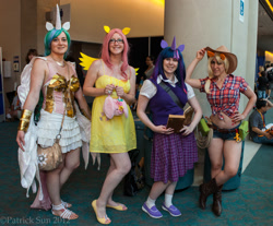 Size: 2000x1656 | Tagged: artist needed, safe, character:applejack, character:fluttershy, character:princess celestia, character:twilight sparkle, species:human, 2012, armor, book, clothing, convention, convention:fanime14, cosplay, front knot midriff, glasses, irl, irl human, midriff, photo, san diego comic con, sandals, sdcc 2012, skirt, sweater vest