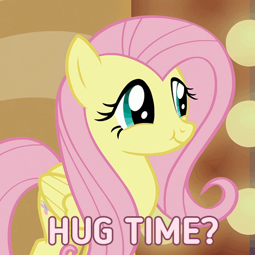 Size: 500x500 | Tagged: safe, edit, edited screencap, screencap, character:fluttershy, species:pegasus, species:pony, episode:viva las pegasus, g4, my little pony: friendship is magic, animated, caption, cute, dawwww, eye shimmer, female, gif, hug request, las pegasus scrunchyshy, mare, shyabetes, smiling, solo, standing