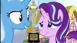Size: 2548x1420 | Tagged: safe, edit, edited screencap, screencap, character:starlight glimmer, character:trixie, ship:startrix, episode:all bottled up, g4, my little pony: friendship is magic, award, cropped, crying, discovery family logo, female, get, index get, lesbian, love, oscar, ponyville, season 7, shipping, tears of joy, trophy