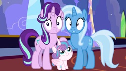 Size: 1190x670 | Tagged: safe, edit, edited screencap, screencap, character:princess flurry heart, character:starlight glimmer, character:trixie, species:alicorn, species:pony, species:unicorn, baby, baby pony, female, foalsitting, holding hooves