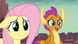 Size: 1896x1068 | Tagged: safe, edit, edited screencap, screencap, character:fluttershy, character:smolder, species:dragon, species:pegasus, species:pony, episode:fluttershy leans in, episode:uprooted, g4, my little pony: friendship is magic, cute, dragon lands, dragoness, female, floppy ears, shyabetes, smiling, smolderbetes