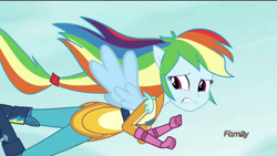 Size: 1200x675 | Tagged: safe, edit, edited screencap, screencap, character:rainbow dash, equestria girls:friendship games, g4, my little pony: equestria girls, my little pony:equestria girls, clothing, female, flying, gloves, motorcross outfit, ponied up, pony ears, solo, teeth, wings