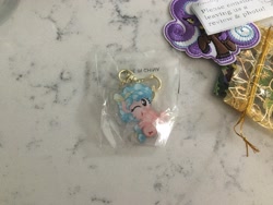 Size: 4032x3024 | Tagged: safe, artist:aleximusprime, character:cozy glow, species:pegasus, species:pony, cozybetes, cute, female, filly, irl, keychain, made in china, one eye closed, photo, sitting, traveling pony museum, wink