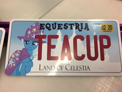 Size: 3264x2448 | Tagged: safe, artist:dashiesparkle, artist:ramivic, character:trixie, species:pony, species:unicorn, cup, female, irl, license plate, mare, photo, raised hoof, solo, teacup