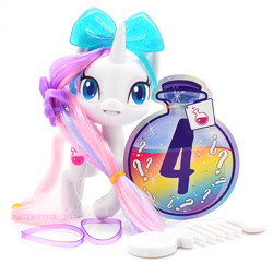 Size: 635x615 | Tagged: safe, photographer:conphettey, character:potion nova, species:pony, species:unicorn, g4.5, bow, comb, female, irl, photo, reveal the magic, simple background, solo, toy, white background