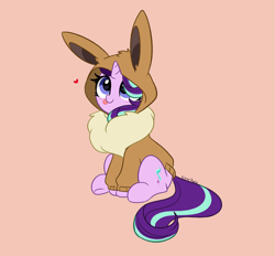 Size: 5144x4768 | Tagged: safe, artist:kittyrosie, character:starlight glimmer, species:pony, species:unicorn, g4, :p, blep, blushing, clothing, costume, crossover, cute, eevee, female, glimmerbetes, hair over one eye, heart, hoodie, kigurumi, mare, nintendo, onesie, pokémon, signature, simple background, sitting, solo, tongue out, video game, weapons-grade cute