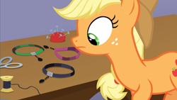Size: 1600x900 | Tagged: safe, screencap, character:applejack, species:earth pony, species:pony, episode:honest apple, g4, my little pony: friendship is magic, apple family member, choker, clothing, cowboy hat, hat, jewelry, looking at something, necklace, scissors, solo, thread