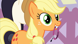 Size: 1600x900 | Tagged: safe, screencap, character:applejack, species:earth pony, species:pony, episode:honest apple, g4, my little pony: friendship is magic, apple family member, behaving like a dog, choker, happy, holding, jewelry, mouth hold, necklace, solo
