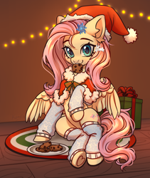 Size: 3800x4500 | Tagged: safe, artist:konejo, character:fluttershy, species:pegasus, species:pony, g4, absurd resolution, christmas, christmas lights, clothing, commission, cookie, cute, dawwww, ear fluff, eyebrows, female, food, hair accessory, hat, holding, holiday, indoors, leg warmers, lights, looking at you, mare, mouth hold, partially open wings, pelerine, present, raised hoof, santa hat, shyabetes, sitting, smiling, smiling at you, solo, underhoof, wings