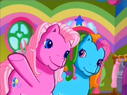 Size: 900x675 | Tagged: safe, screencap, character:pinkie pie (g3), character:rainbow dash (g3), species:earth pony, species:pony, episode:rainbow dash's hat fashion party, g3, meet the ponies, duo, looking at someone, raised hoof, smiling